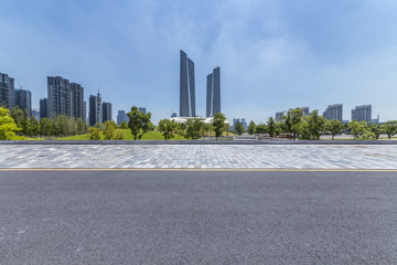 Panoramic skyline and modern business office buildings with empty road,empty concrete square floor