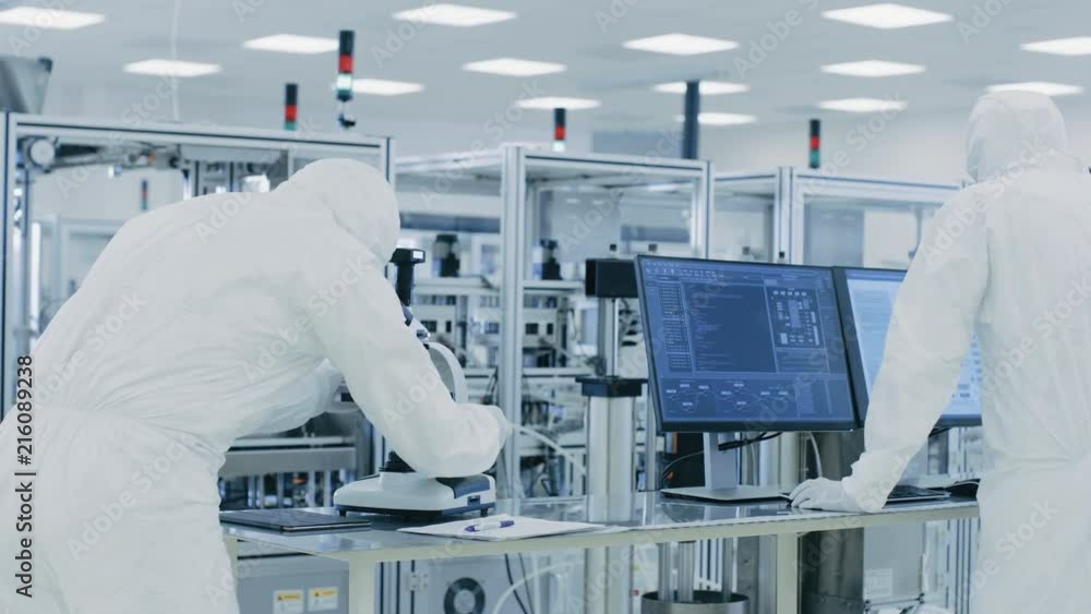 Aufkleber in laboratory scientists in protective clothes doing research, using microscope and entering data in