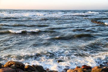 Sea landscape with rocky coastline during sunset. Baltic sea.