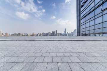 Fototapeta premium Panoramic skyline and modern business office buildings with empty road,empty concrete square floor