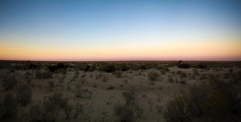 Panorama of ship cemetery at sunset near Moynaq, Karakalpakstan, Uzbekistan