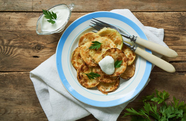 Fried zucchini with sour cream and fresh herbs