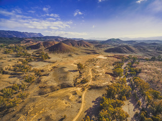 Aerial landscape Flinders Ranges mountains and rolling hills with trees in South Australia