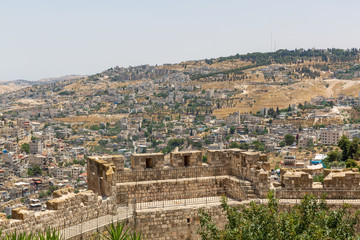 Fototapeta na wymiar Wall of old city and neighborhoods of East Jerusalem