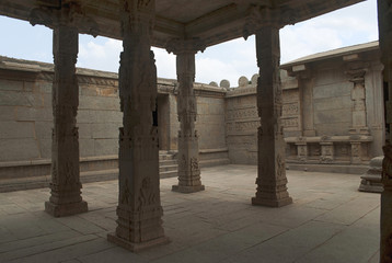 The open mandapa with tall and ornate cubical type of Vijayanagara pillars, Hazara Rama Temple. Royal Center or Royal Enclosure. Hampi, Karnataka. View from the south-east.