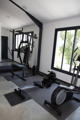 Fototapeta na wymiar Empty modern gym interior with equipment And Machines
