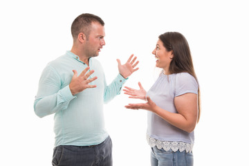 Portrait of young happy couple showing arguing gesture