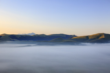 A magnificent sunrise in Castelluccio di Norcia. expecting more to the thousand colours of flowering 