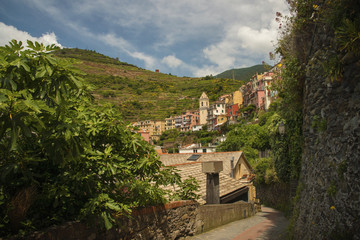 Fototapeta na wymiar Panoramic view at Manarola fishing village, one of five at Cinque Terre, with charming colorful buildings