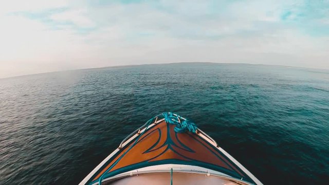 Cinematic clip of speeding in a speedboat POV in slow motion