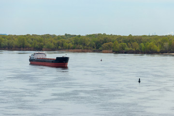 Fototapeta na wymiar Cargo ship sailing on the river Dnieper