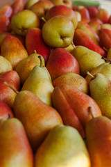Background of freshly harvested ripe organic pears on sale at a farmers 