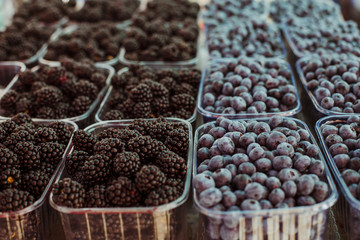 Black berries and blue berries in a market