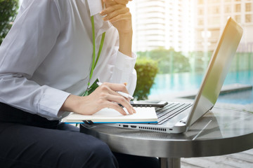 Happy Business woman working with Laptop and notebook at outdoors. Concept Business Image