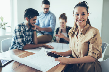 Group of architects and designers working and collaborating on project