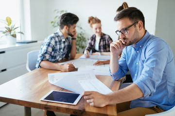 Obraz premium Group of architects and designers working and collaborating on project