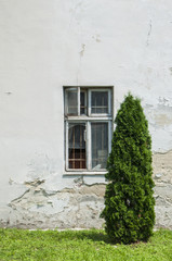 Fototapeta na wymiar A wall of an old building with a window.