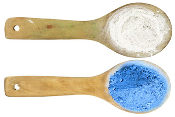 blue and white powder on wooden spoons with clipping path in isolated on white background