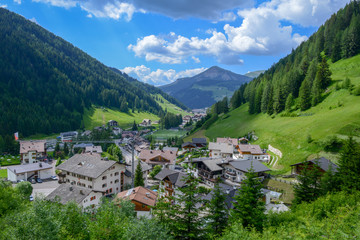 Fototapeta na wymiar Village on Gardena valley in the Dolomites