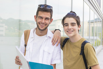 young students with books and notebooks on campus or college