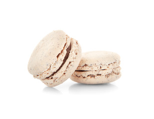 Tasty macarons on white background