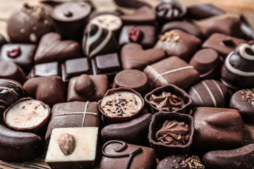 Yummy chocolate candies on table, closeup