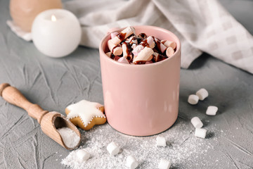 Cup of hot chocolate with marshmallows on table