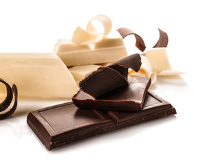 Pieces of chocolate with curls, isolated on white