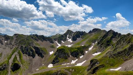 view of Pyrenees mountains with cloudy blue sky