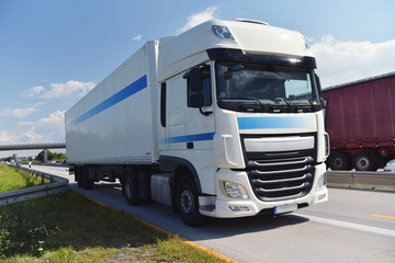 Obraz na płótnie Canvas LKW zum Warentransport auf der Autobahn // truck for shipping of goods on highway