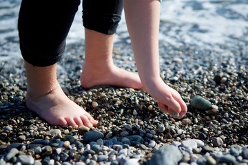 The hand of a man of uncertain sex.