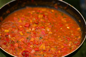 large pan of Italian sauce with tomatoes