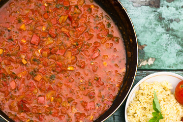 large pan of Italian sauce with tomatoes