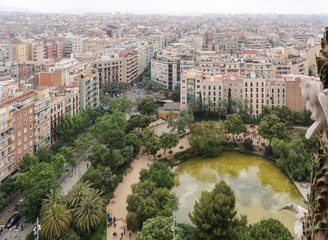 View to Barcelona from the top of the basilica, with the green pond on the Plaza de Gaudi (Gaudi...