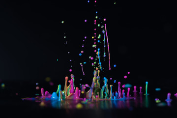 Abstract sculptures of colorful splashes of paint. Dancing liquid on a black background. Ink water...
