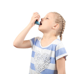 Little girl using inhaler on white background. Allergy concept