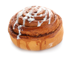 Tasty sweet cinnamon bun with icing on white background