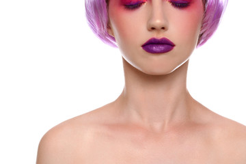 Young woman with unusual hair and professional makeup on white background