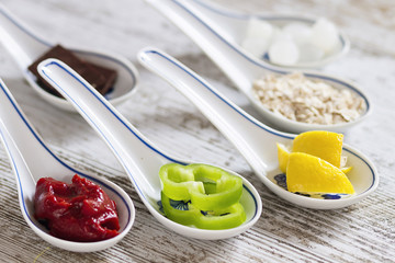 Porcelain spoons with doos ingredients