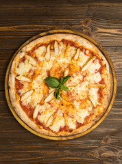 Pizza with chicken breast, pineapple and mozzarella cheese
