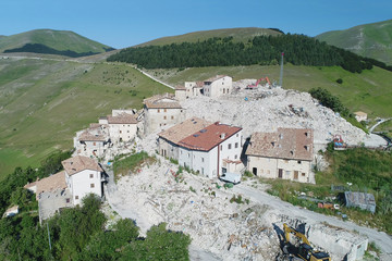 Flying on Castelluccio di Norcia, between ruins and bloom of flowers
