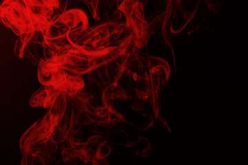 Red smoke abstract on black background, fire design and darkness concept