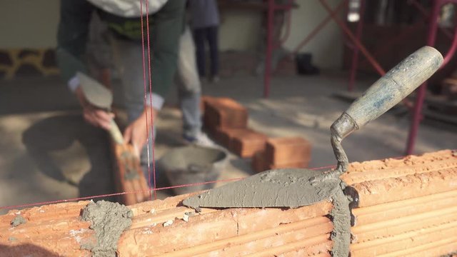 Worker building masonry house wal