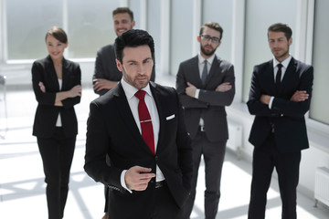 serious businessman standing in the office