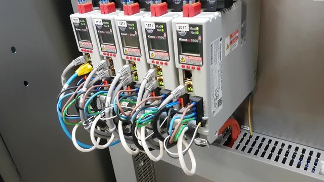 Working servo drives in electrical cabinet of a machine with leds CLOSE UP front right.