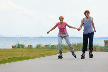 Fototapeta premium roller skater couple skating outdoor