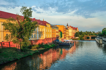 Landscape, old buildings under the river, Poland, sunset