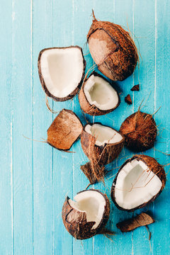 group of coconut on a blue wooden background, split, banner, copy space