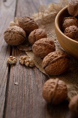 Walnuts kernels in wooden bowl, Walnut healthy food Top view