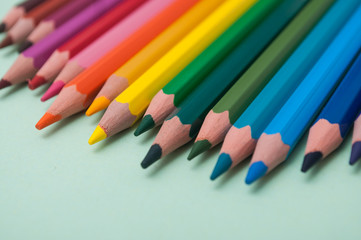 closeup of colouring pencils on color background